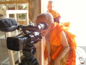 a novice looking through a camera in thailand